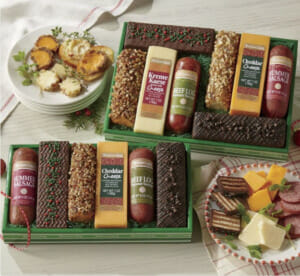 Cheese bars and beef logs gift assortments including tortes and cheese logs with slices on a plate.