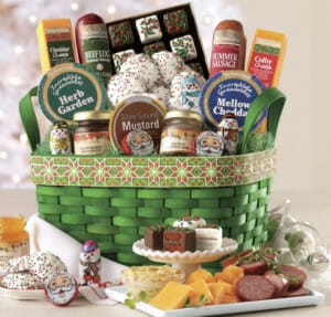 Green woven holiday basket of cheese, spreads, chocolates, cookies, preserves and mustards, with samples.