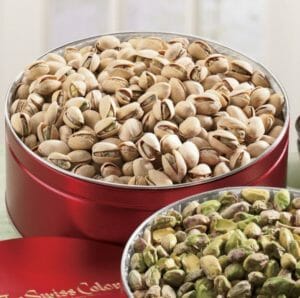 Unshelled and Shelled Pistachios in red Swiss Colony tins.