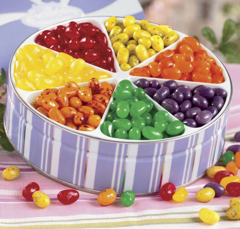Colorful jelly belly jelly bean assortment in a divided lavender and white striped tin.
