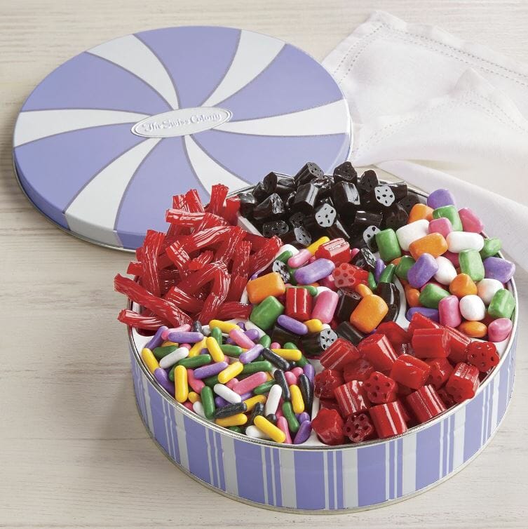 Colorful assortment of Licorice candies in a lavender stripe Swiss Colony tin.