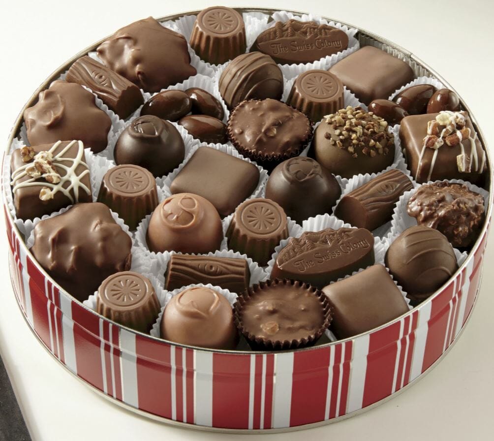 Chocolate classic candy assortment in a red and white striped tin.
