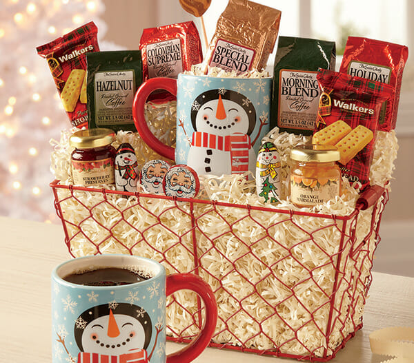 Red wire gift basket filled with a variety of coffee blends, shortbread cookies and a snowman mug.